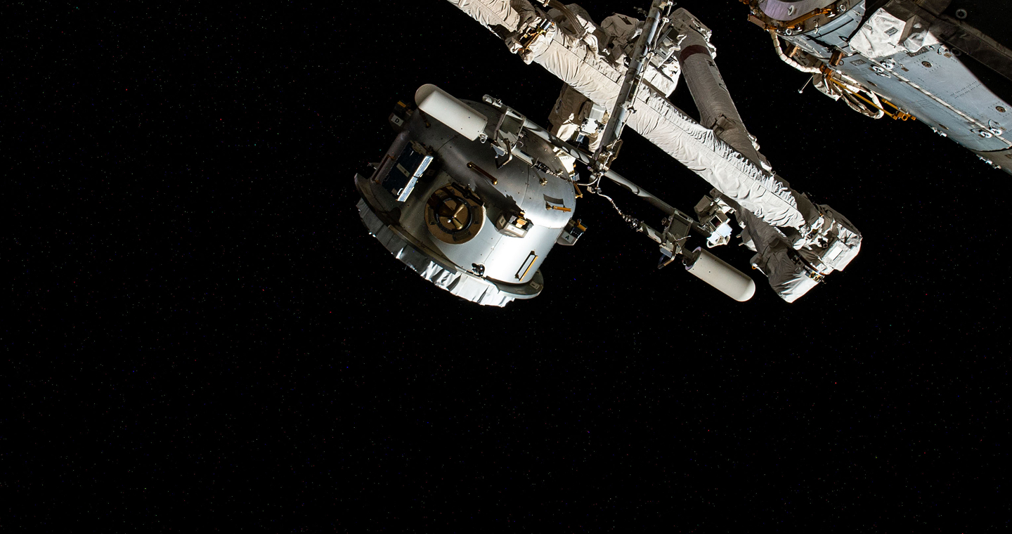 Spacecraft docked at space station in orbit