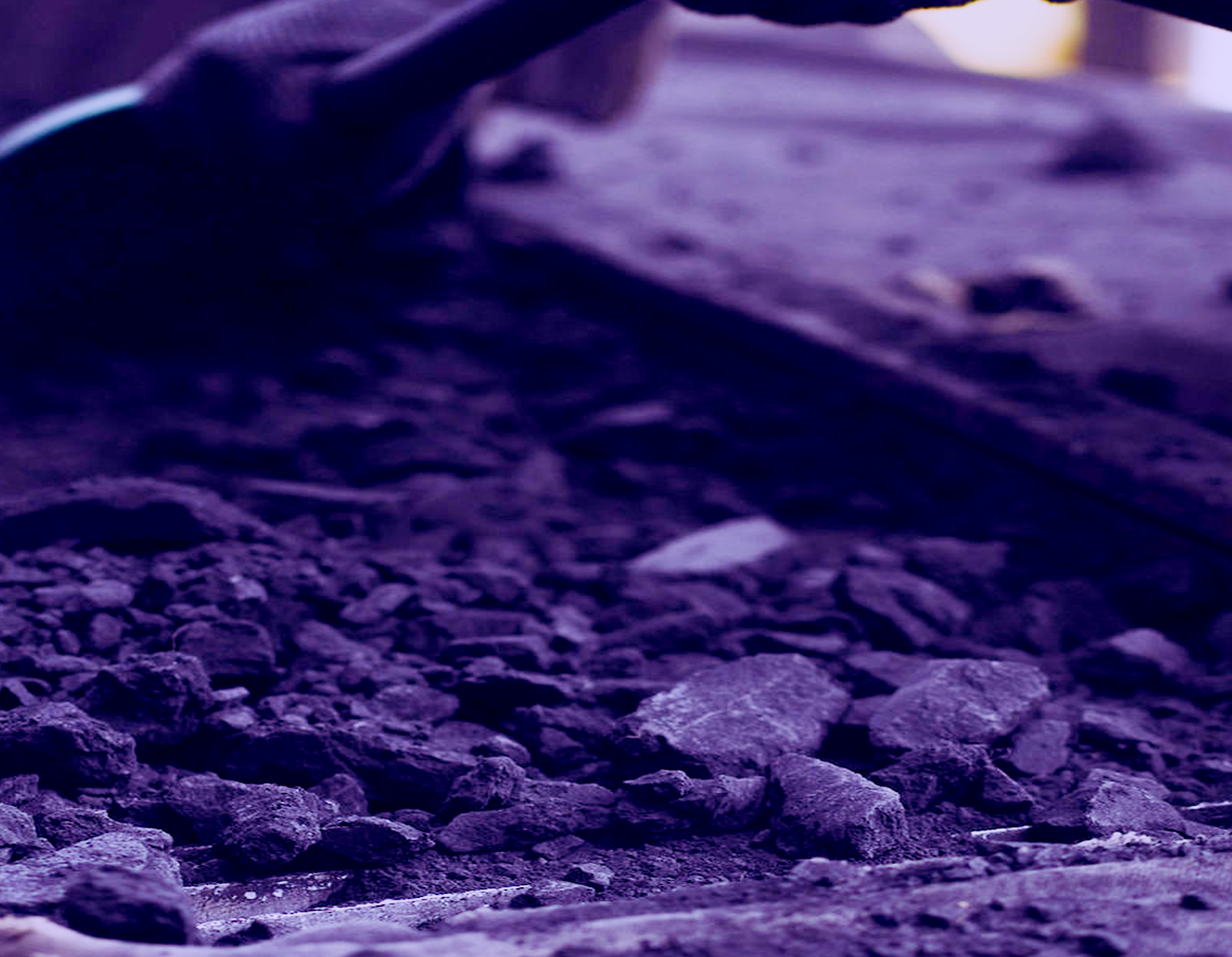 Close-up of coal and rocks with shovel