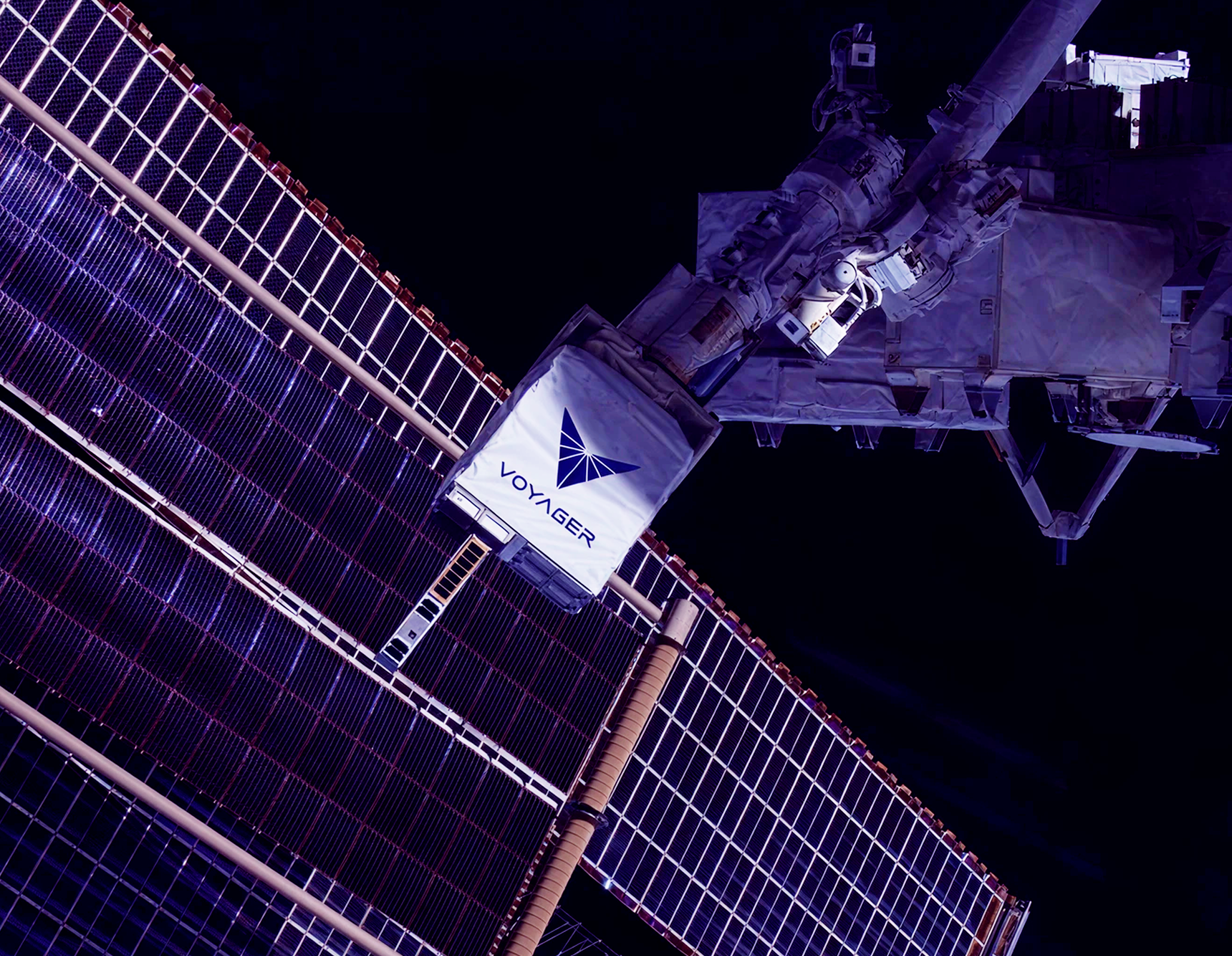 Space station solar panels and equipment at night.