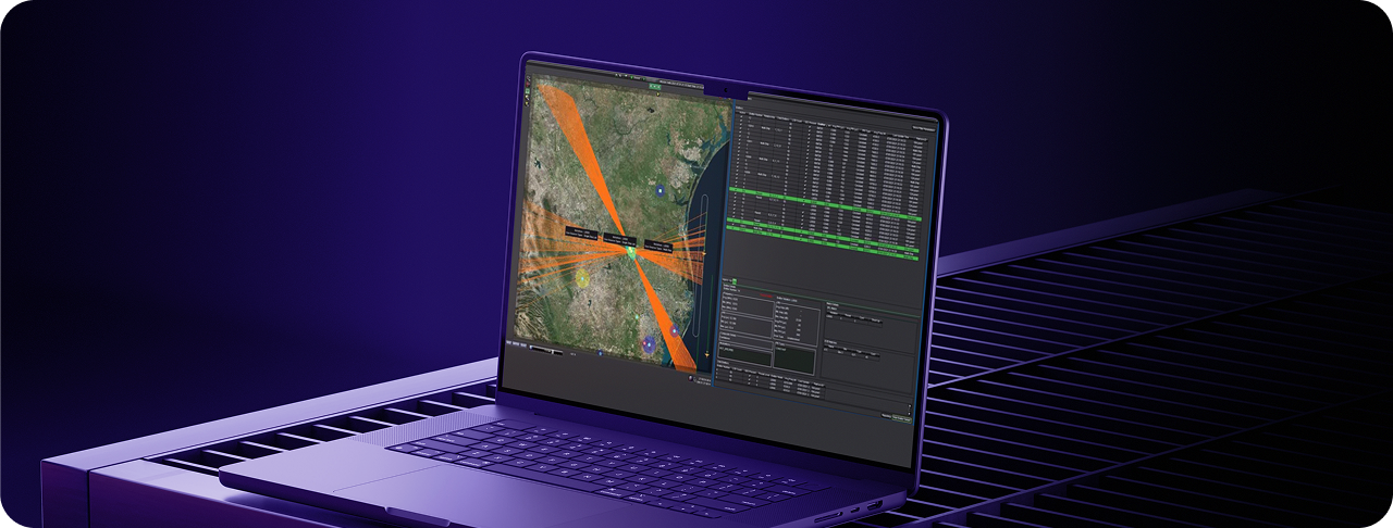 Laptop displaying geographical monitoring software interface.