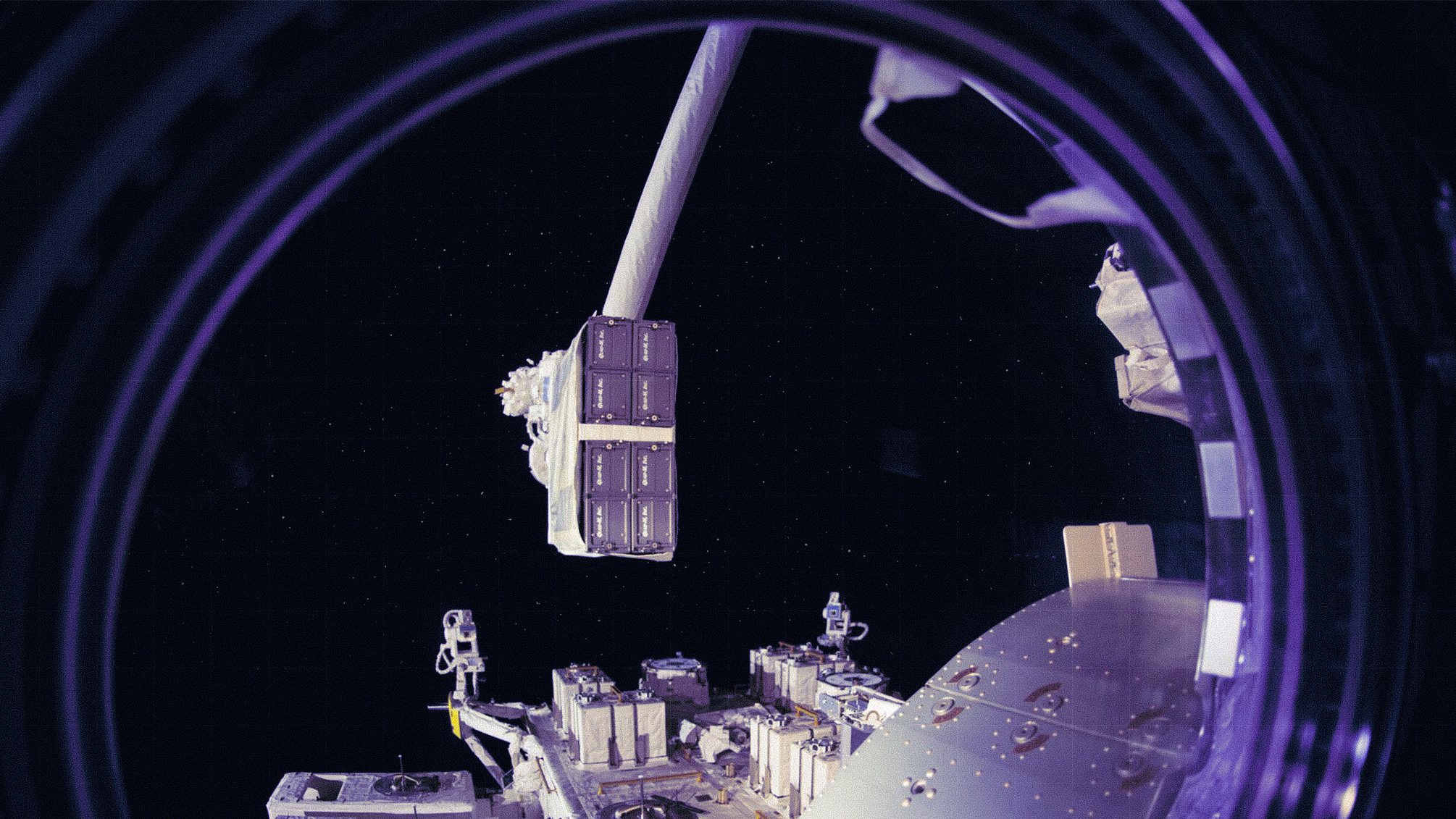 Space station arm moving equipment in orbit.