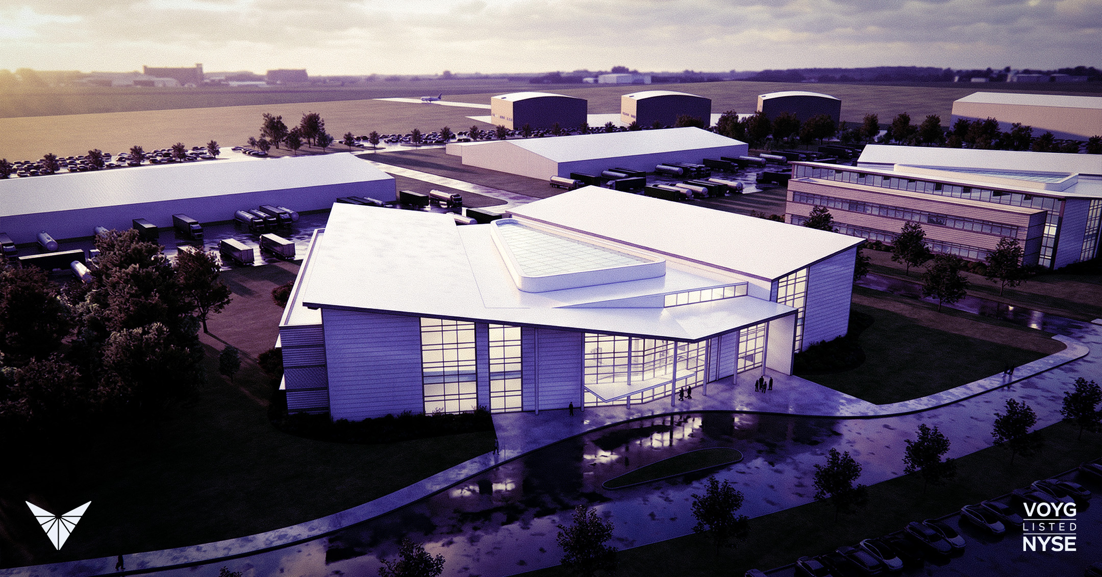 Modern industrial facility with surrounding buildings and trucks.
