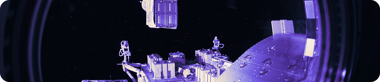 Space station equipment in orbit with starry background.